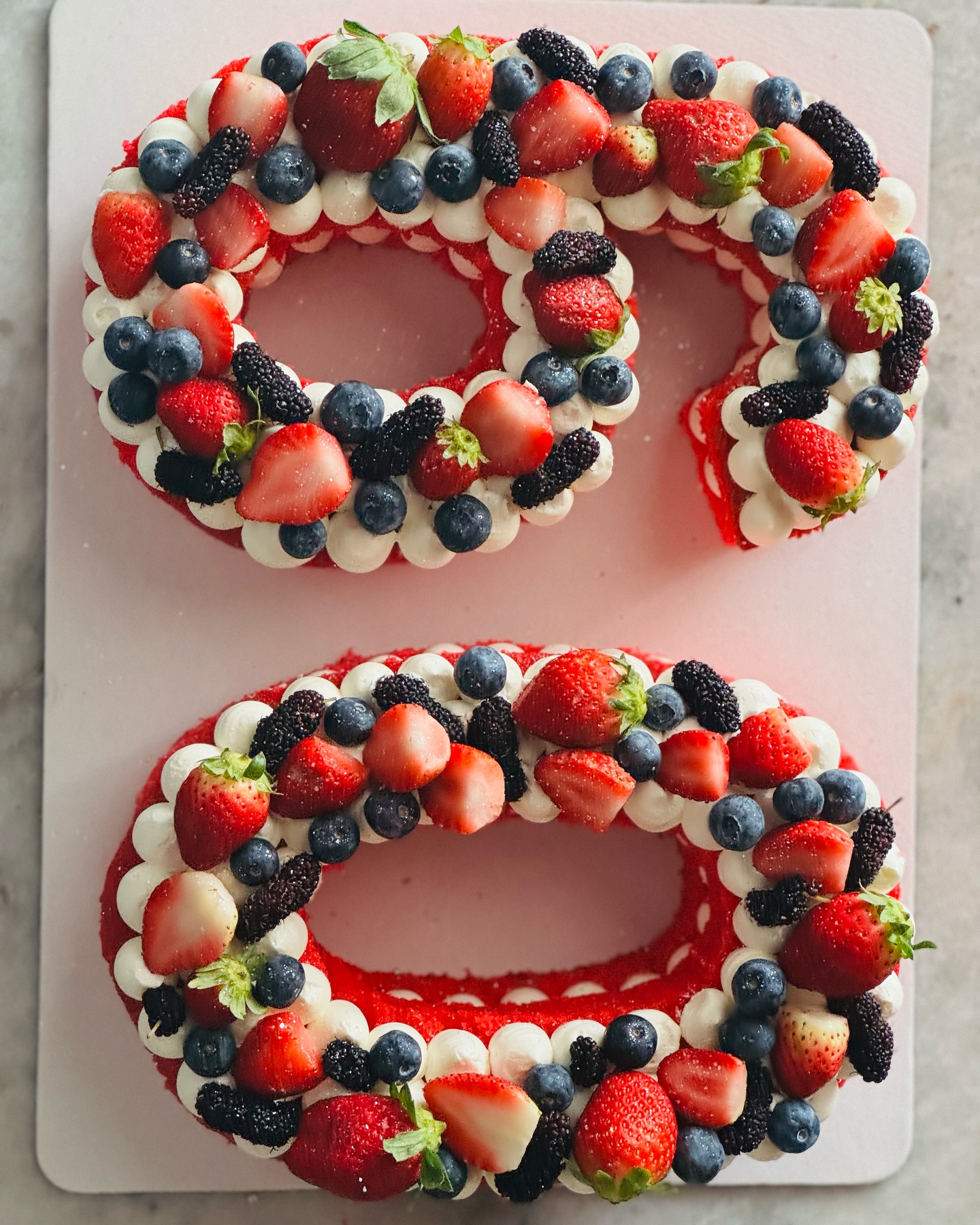 Number 26 cream tart cake topped with berries